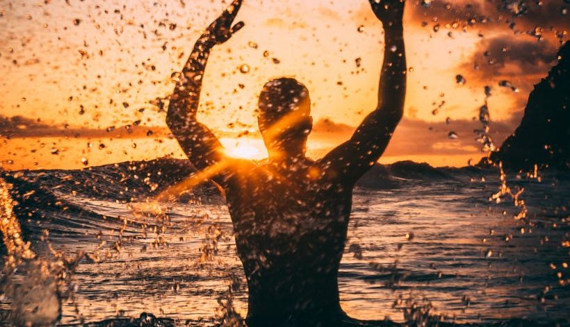 silhouette photography of man at beach during sunset